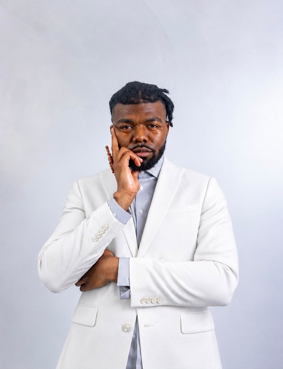 Your astrology consultant in a white suit